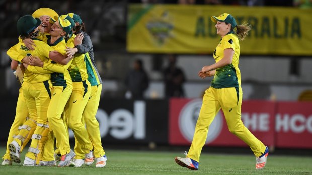 Job done: Australia's women celebrate their Ashes triumph on Friday night.
