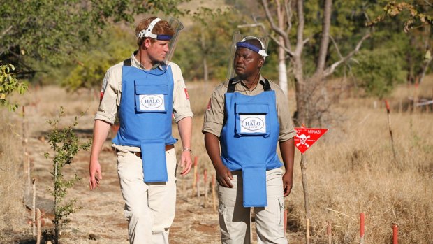 Prince Harry with a deminer from The HALO Trust in 2010.
