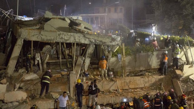 Dozens of children remained trapped inside at the collapsed Enrique Rebsamen school in Mexico City after the 7.1-magnitude earthquake.