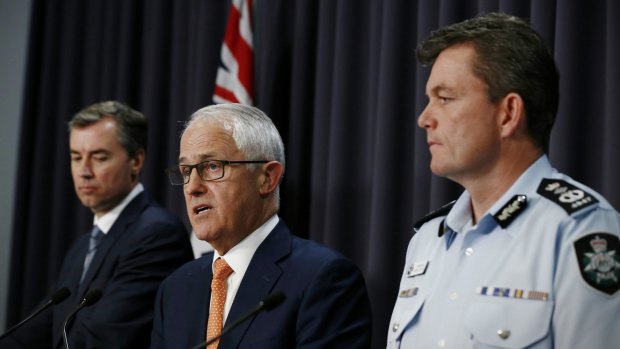 Michael Keenan, Malcolm Turnbull and AFP Commissioner Andrew Colvin address the media.