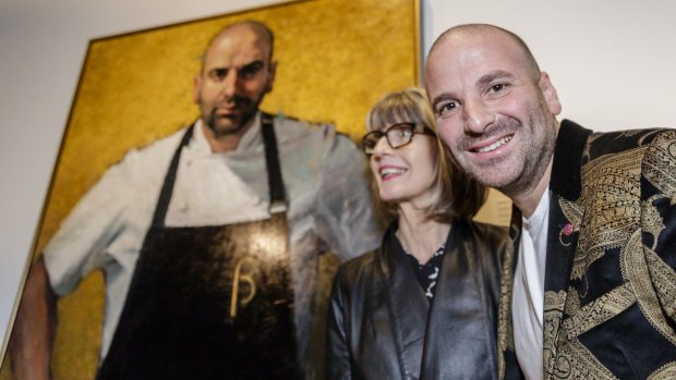 George Calombaris and artist Betina Fauvel-Ogden celebrate Fauvel-Ogden's portrait of the chef  being named the winner of the Archibald Prize's Packing Room Prize. 