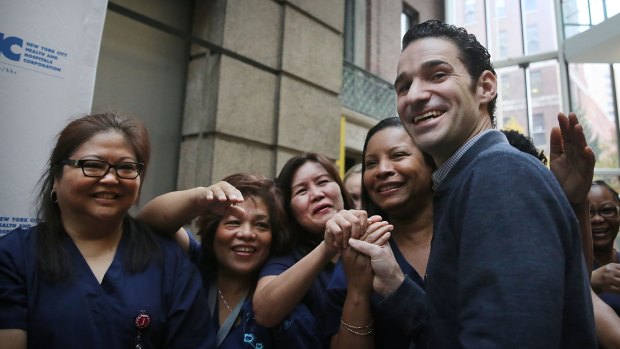 Dr. Craig Spencer with some of the nurses who helped him to recovery at New York's Bellevue Hospital.
