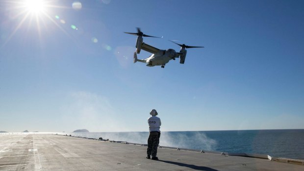 A US MV-22 Osprey takes off HMAS Canberra during exercise Talisman Saber.