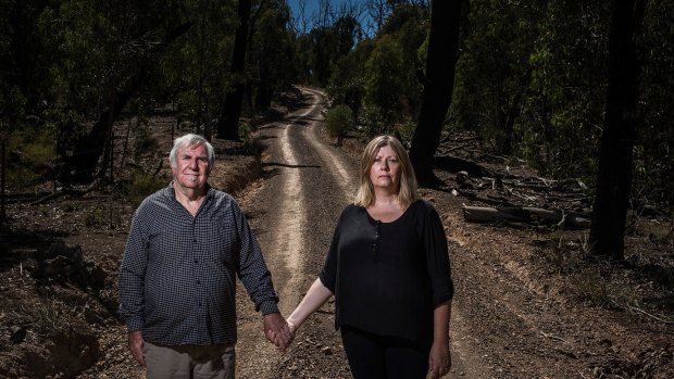 Suzi Kerr and Denis Spooner on the track that Denis used to escape the fire that claimed the life of his wife and son.