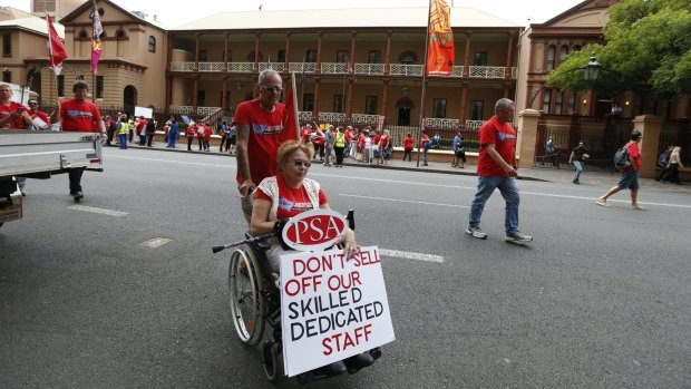 Hundreds took part in the rally outside Parliament House on Thursday to protest against the privatisation of disability services.