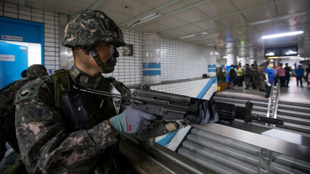 A soldier stands guard during an anti-terror drill on the sidelines of the Ulchi Freedom Guardian military exercises at a subway station in Seoul.