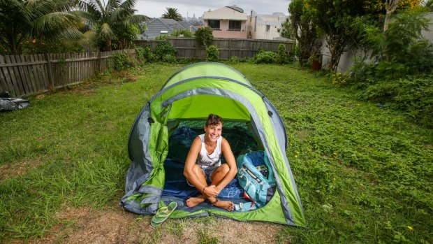 Backpacker Kimberley Boutard from Paris camping in the backyard of a Dover Heights home in Sydney on Saturday.