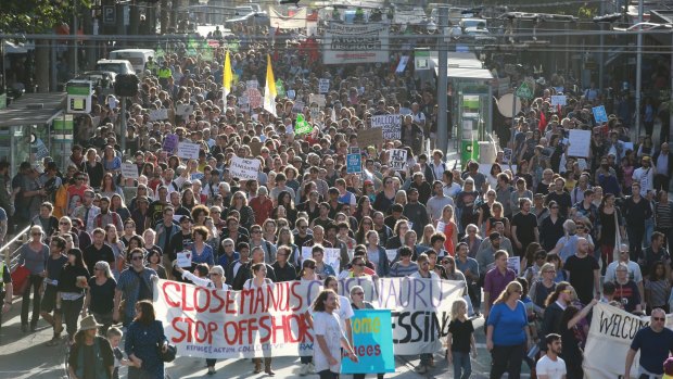 Thousands flooded through Melbourne in Thursday's 'Let Them Stay' rally.