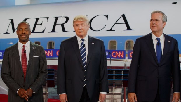 Donald Trump is flanked by Ben Carson, who is second in most polls, and the Republican establishment's favourite, Jeb Bush.