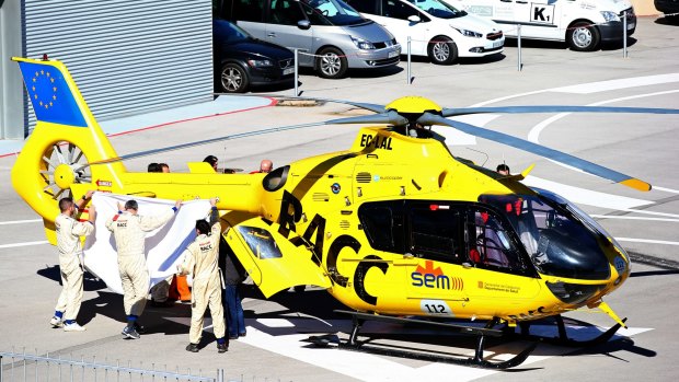 Serious accident: Fernando Alonso of McLaren Honda is transferred from the medical centre to the helicopter after crashing during day four of Formula One Winter Testing at Circuit de Catalunya on February 22.