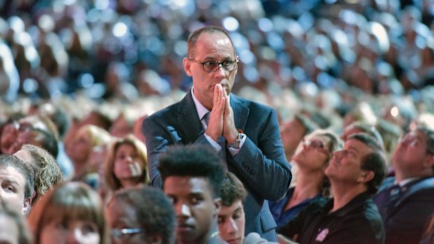 Parent Fred Guttenberg watches a monitor honoring the 17 students, including his daughter, and teachers who were killed at Marjory Douglas Stoneman High School.