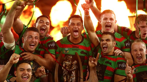 Glory daze: John Sutton leads the celebrations as Souths break their 43-year drought in 2014.