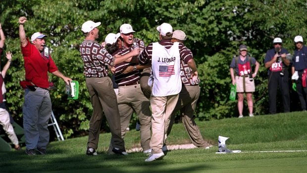 Controversy: Justin Leonard of the USA is mobbed by the American team after sinking a long birdie putt during the 1999 Ryder Cup.