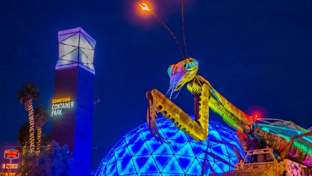 A giant praying mantis welcomes you to Downtown Container Park.