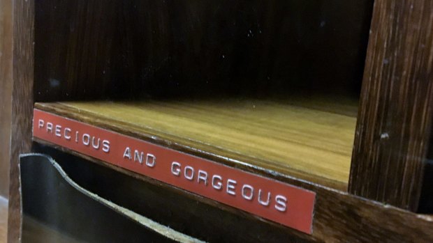 A pigeon hole labelled "precious and gorgeous". 