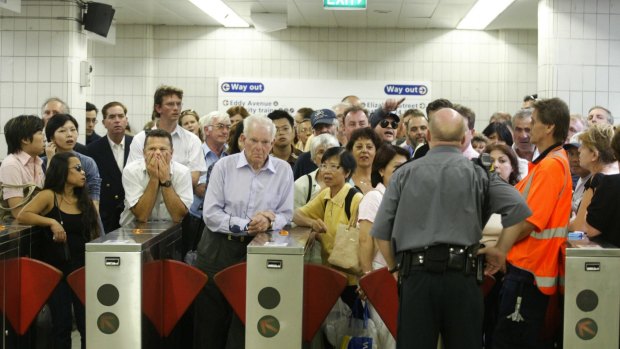 More of the same: Commuters struggle through the ticket barriers at Central station.