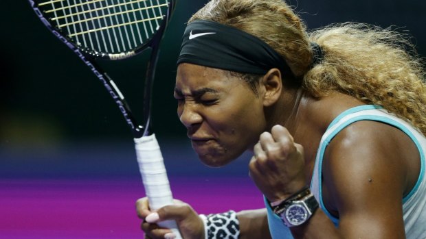 Not happy: Serena Williams show her frustration during her loss to Simona Halep.