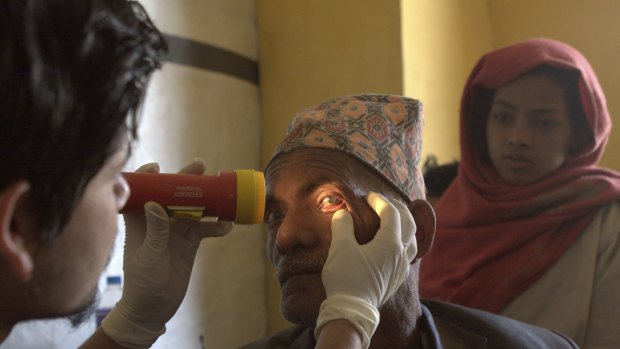 Jokh and his granddaughter Kamala travelled along dirt tracks in remote Nepal to an eye clinic to get his cataract treated.