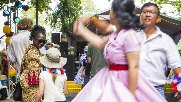 Esther Khakula and Emily Joehnk Escobar, 6, dance together at this year's festival.