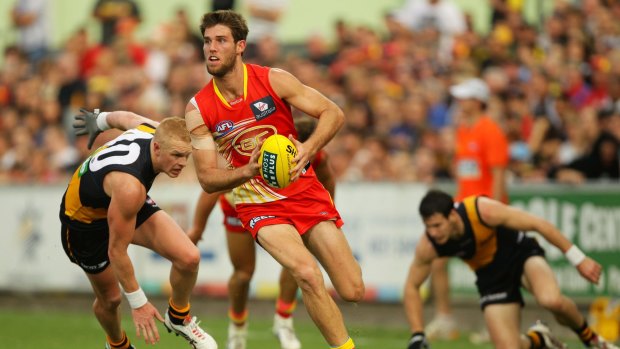 Heading to Penrith: Former Gold Coast Suns player Josh Hall runs with the ball against the Richmond Tigers in 2012.