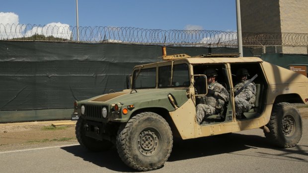 Military personnel patrol outside Camp 6 at Guantanamo Bay earlier this month. 