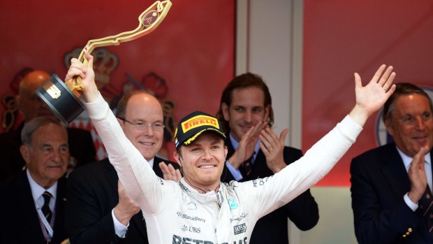 German driver Nico Rosberg celebrates on the podium after winning  the Monaco Grand Prix on Sunday.