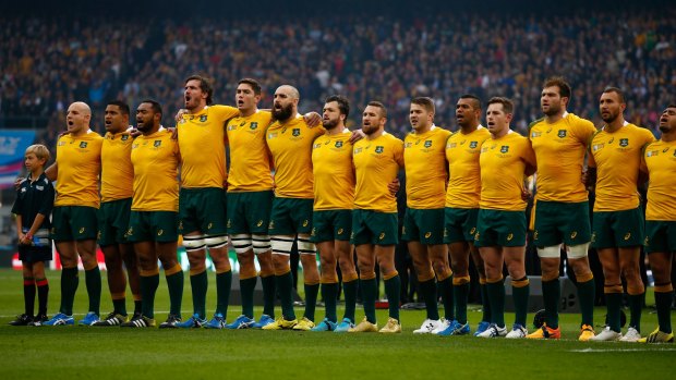 United they stand: The Australia team sings the national anthem prior to kickoff against Scotland.