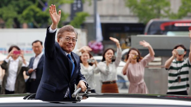 South Korea's President Moon Jae-in greets supporters after his inauguration ceremony in Seoul.