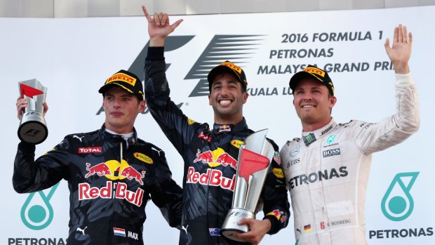 Podium place: Red Bull drivers Daniel Ricciardo of Australia (centre), Max Verstappen of Netherlands (left) with Mercedes' Nico Rosberg of Germany.