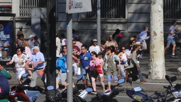 People flee in terror after the Barcelona van attack.
