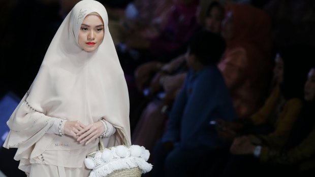 Modest-wear is the new black: a model shows a creation by SI.SE.SA during Indonesia Fashion Week.