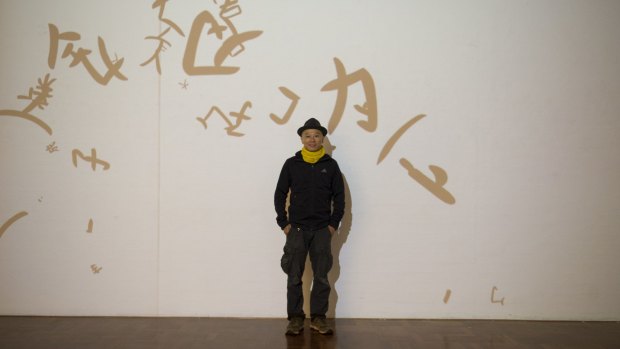 Hong Kong artist Hung Keung with his 
<i>Bloated City / Skinny Languages</i>, interactive projection art work at the ANU School of Art Gallery.