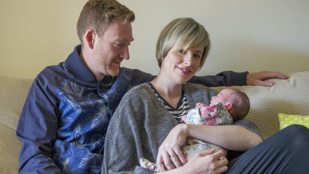 <i>The Voice's</i> Amber Nichols with husband Pete at home in Canberra with their new baby daughter Olive.
