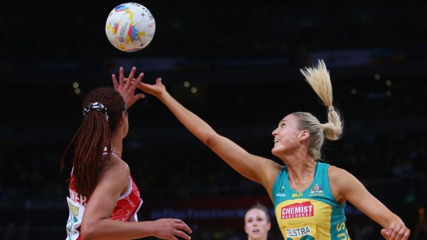 Lateisha Kidner of Wales and Caitlin Bassett of Australia compete for the ball.