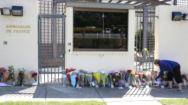 Canberrans leave flowers in front of the Embassy of France following the terrorist attack in Paris in November 2015.  