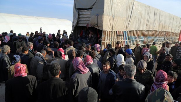 Refugees who have fled bombing in Aleppo wait at the Bab al-Salam crossing, opposite the Turkish province of Kilis, on Friday.