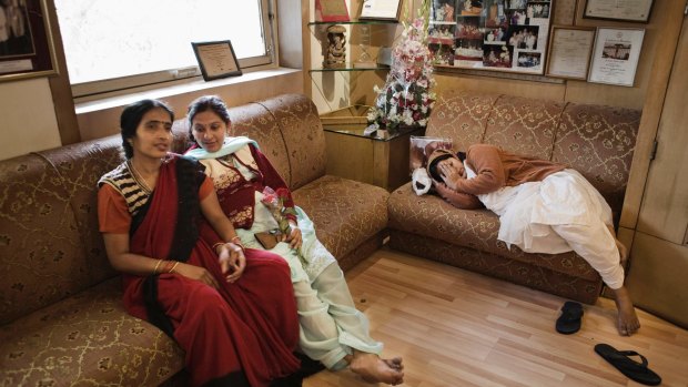 Surrogates Neelam Jaisawal (centre) and Neelam Chauhum (right) wait for a check-up at the Delhi Fertility and Research Centre in New Delhi in 2009.