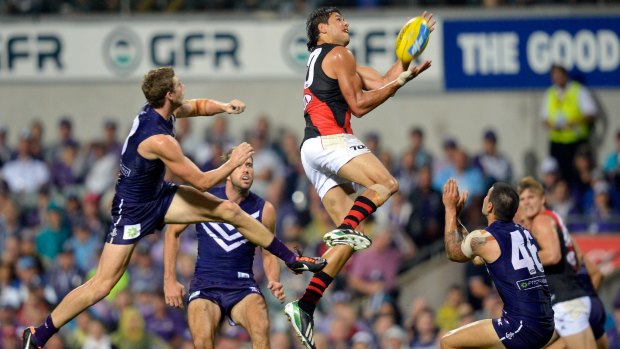 AFL. Round 3.Fremantle v Essendon at Patersons Stadium. Fremantle's Zac Dawson to late to stop Essendon's Patrick Ryder. 12th April 2013.Picture Sebastian Costanzo. The Age.