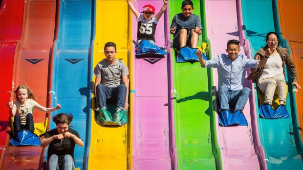 Children enjoy the giant slide on the first day of the Royal Melbourne Show at Melbourne Showgrounds.