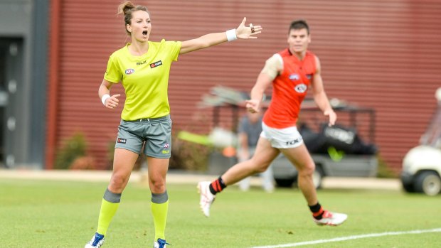 Taking charge: Field umpire Eleni Glouftsis  awards a free kick in the Essendon intra-club game.