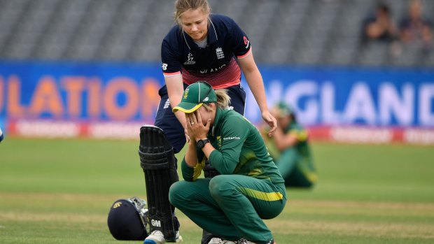 Anya Shrubsole goes over to console South Africa captain Dane van Niekerk.