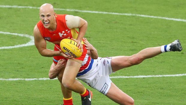 He's back: Gary Ablett stands in a Liam Picken tackle against the Bulldogs.
