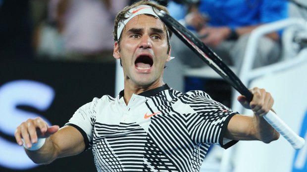 Roger Federer celebrates winning in his fourth-round match against Kei Nishikori.