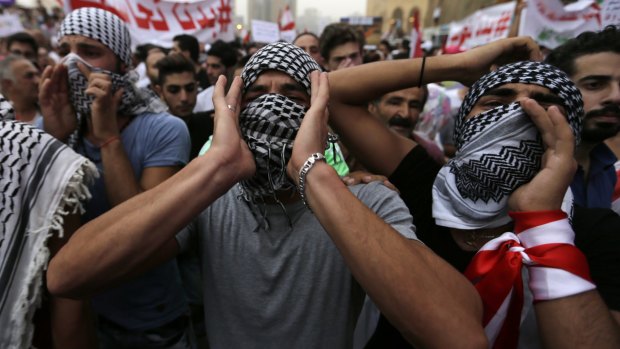 Lebanese anti-government protesters shout slogans during a protest against the continuing garbage crisis and government corruption in downtown Beirut on Wednesday.