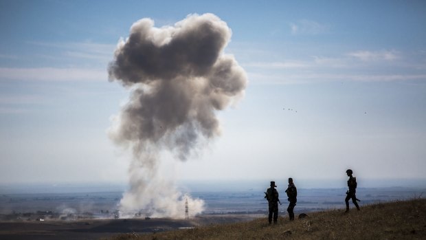 A car bomb, from the Islamic State, explodes near peshmerga vehicles that had just entered a small village on Highway 47, in Mount Sinjar, Iraq.