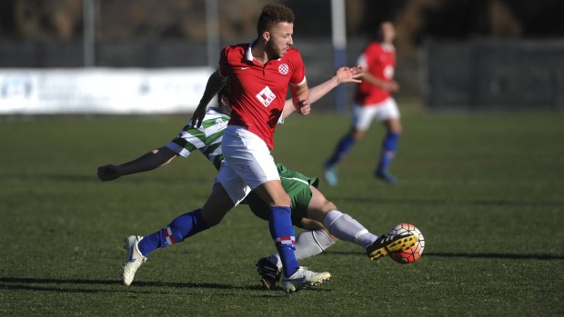 Thomas James (red) scored twice for Canberra FC in Saturday's win over Woden Weston. 