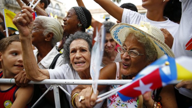 Cubans strain to get close to Pope Francis as he leaves San Cristobal Cathedral in Havana on Sunday.
