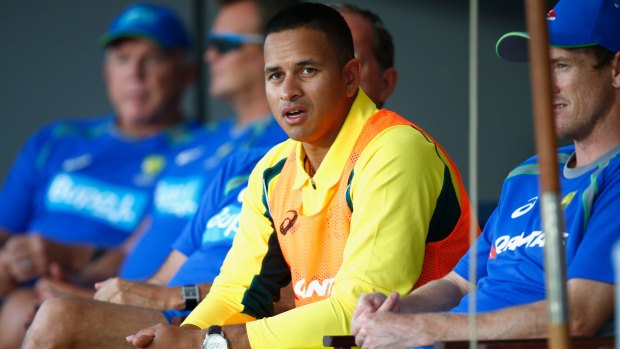 Time to take off that vest: Usman Khawaja looks on as Australia loses game one to New Zealand.