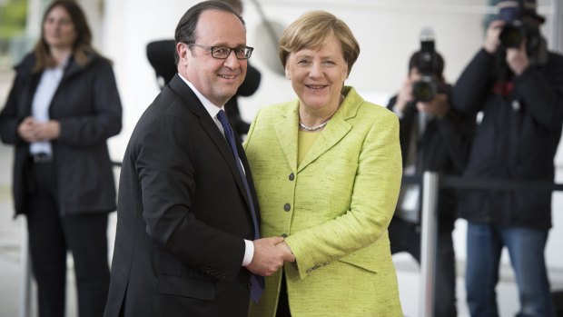 Francois Hollande and Angela Merkel during the outgoing French president's last official visit to Germany.