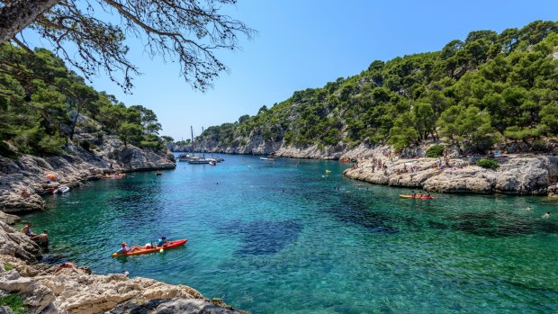  Kayaking in the calanque of Port-Pin near Cassis, southern France.